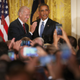 President Barack Obama (right) and Vice President Joe Biden react after a heckler protesting deportations is removed from a reception for LGBT Pride Month in the East Room of the White House on June 24, 2015, in Washington, D.C.
Chip Somodevilla/Getty Images